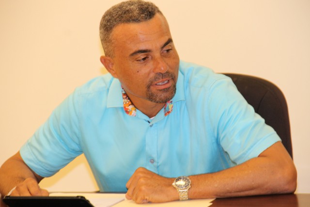 Ernie France, Chairman of the Nevis Division of the St. Kitts and Nevis Chamber of Industry and Commerce delivering remarks at a meeting for executive members with Premier of Nevis Hon. Vance Amory at the Premier’s Ministry at Pinney’s on September 13, 2016